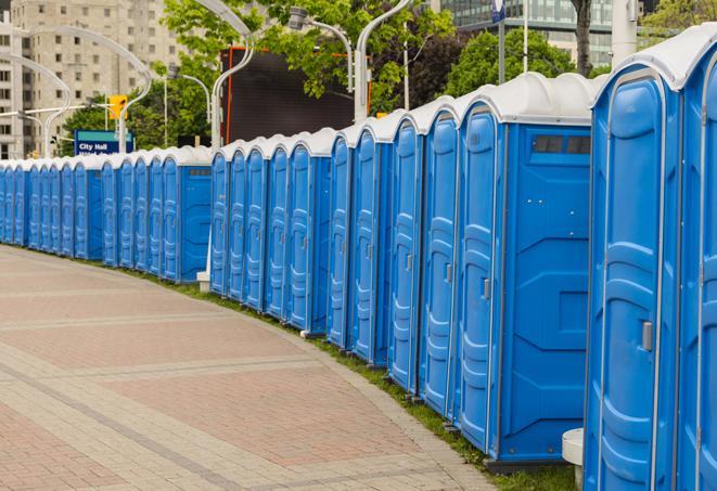 a line of portable restrooms at a sporting event, providing athletes and spectators with clean and accessible facilities in Merritt Island